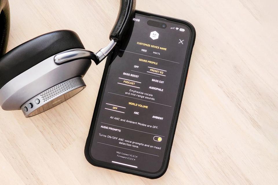 master and dynamic mw75 headphones with phone showing the audio app