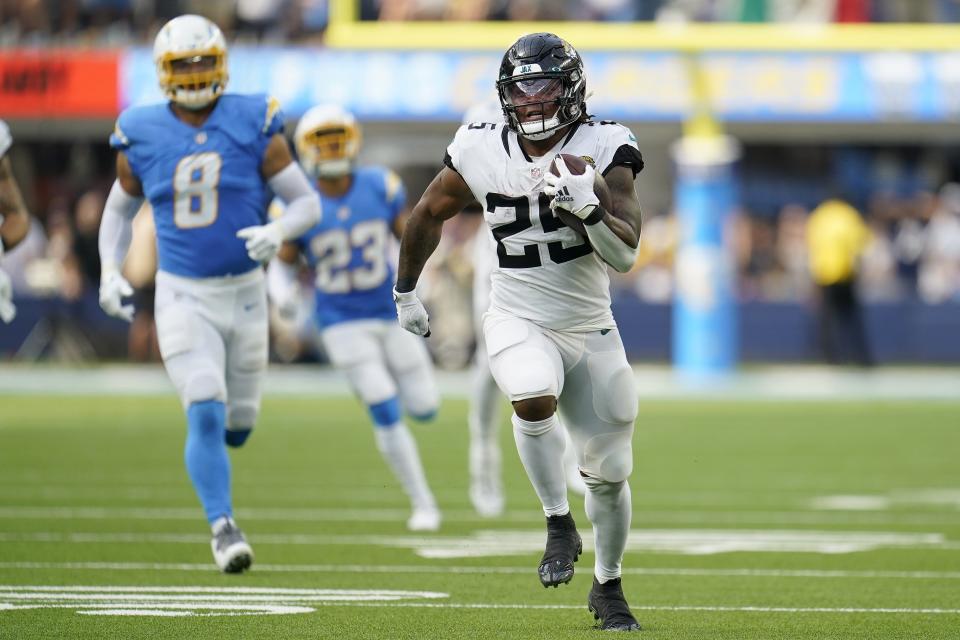 Jacksonville Jaguars running back James Robinson (25) runs for a touchdown during the second half of an NFL football game against the Los Angeles Chargers in Inglewood, Calif., Sunday, Sept. 25, 2022. (AP Photo/Marcio Jose Sanchez)