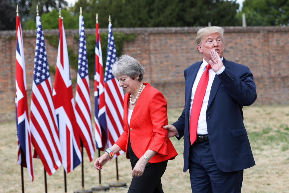 FILE: U.S. President Donald Trump, speaks to the media as he holds onto Theresa May, U.K. prime minister, following their joint news conference at Chequers in Aylesbury, U.K., on Friday, July 13, 2018. An emotional Theresa May announced she will quit as Britains prime minister after admitting she had failed to deliver the one task that defined her time in office -- taking the country out of the European Union. Photographer: Chris Ratcliffe/Bloomberg via Getty Images