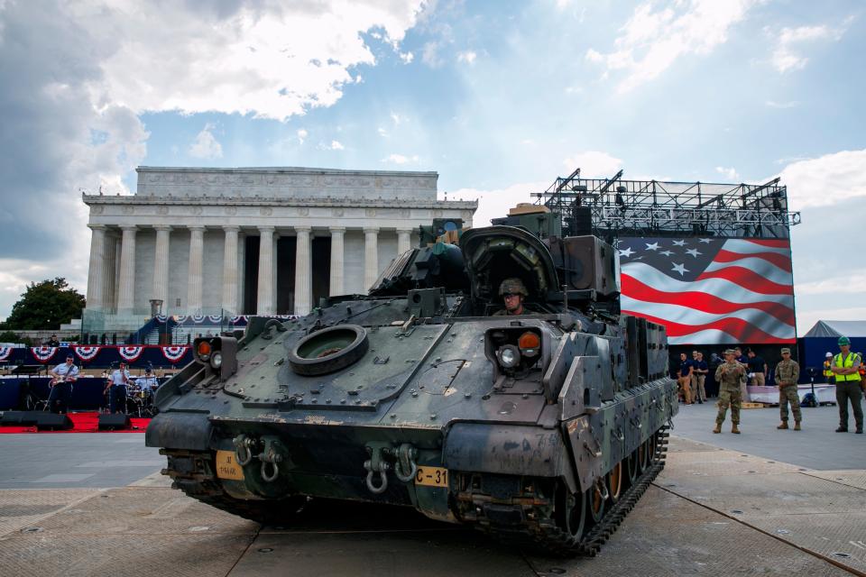 An Army driver with the 3rd Infantry Division, 1st Battalion, 64th Armored Regiment, drives a Bradley Fighting Vehicle into place by the Lincoln Memorial, Wednesday, July 3, 2019, in Washington, ahead of planned Fourth of July festivities with President Donald Trump. (AP Photo/Jacquelyn Martin) ORG XMIT: DCJM109