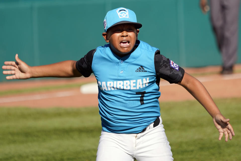 Curacao starting pitcher Jay-Dlynn Wiel (7) celebrates after the final out against Mexico during a baseball game at the Little League World Series tournament in South Williamsport, Pa., Thursday, Aug. 25, 2022. (AP Photo/Tom E. Puskar)