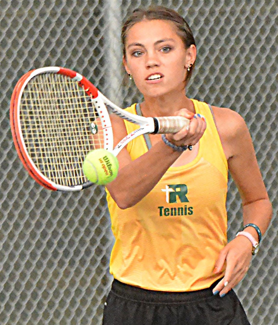 River Haskell of Aberdeen Roncalli hits the ball during a high school girls tennis dual against Watertown on Thursday, Sept. 21, 2023 at the Highland Park Courts in Watertown.