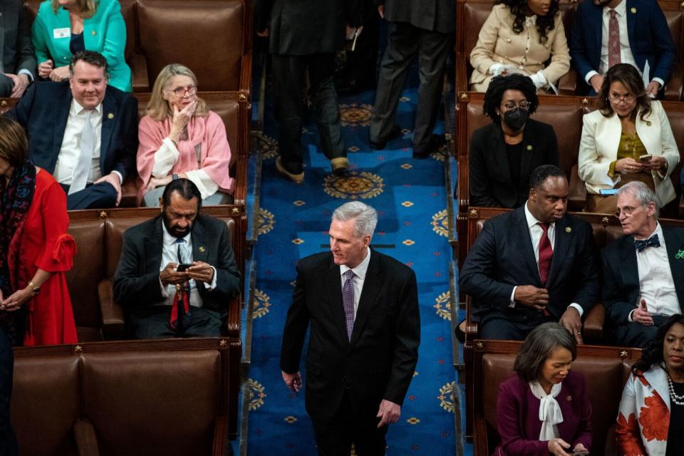 Kevin McCarthy ) walks into the House Chamber Wednesday.