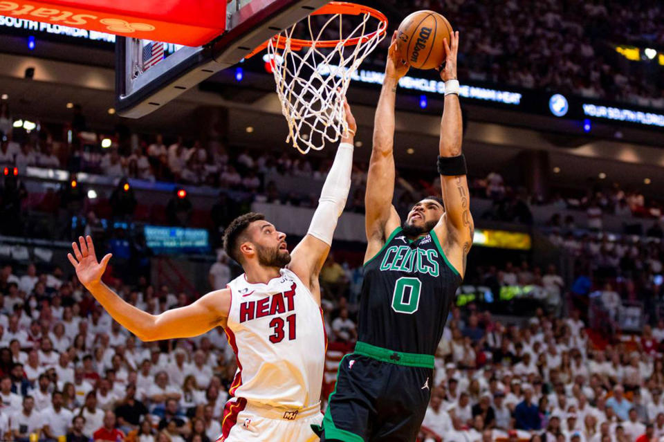 Boston Celtics forward Jayson Tatum (0) dunks on Miami Heat forward Max Strus (31) during the first quarter of Game 3 in the Eastern Conference finals. (D.A. Varela/Miami Herald/Tribune News Service via Getty Images)