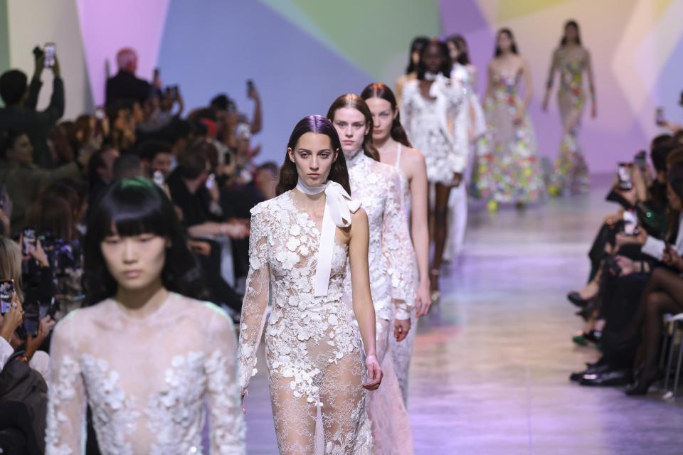 Models wear creations for the Elie Saab ready-to-wear Spring/Summer 2023 fashion collection presented Saturday, Oct. 1, 2022 in Paris. (Photo by Vianney Le Caer/Invision/AP)