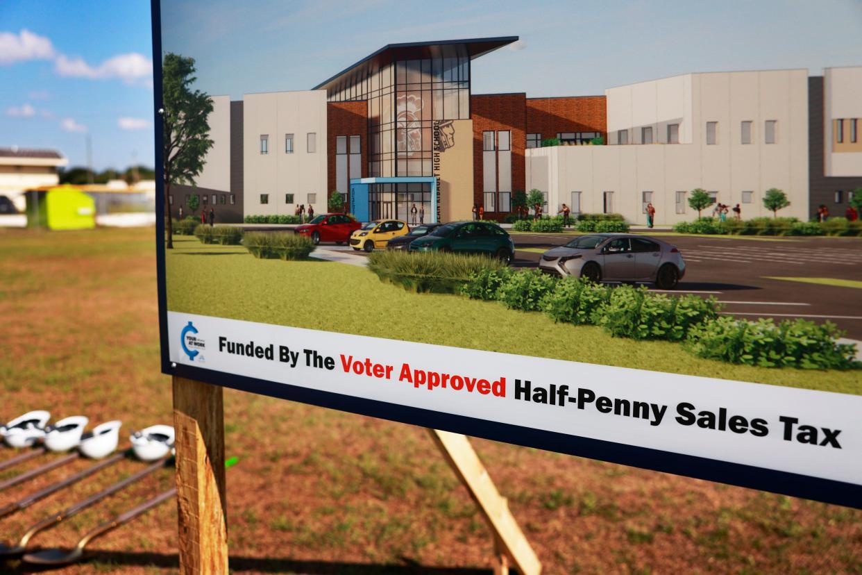 A rendering posted near shovels for a ceremonial groundbreaking shows a planned exterior for the new Jean Ribault High School being built to replace the original 1957-vintage school on Jacksonville's Northside. Construction will last until 2025.