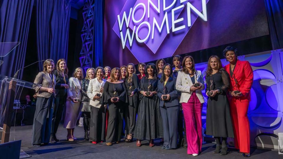 On stage at the March 21 Multichannel News Wonder Women of New York event at New York’s Ziegfeld Ballroom (From l.): Kate Morgan, Gina Reduto, Tina Thornton, Stephanie Dorman, Ingrid Ciprián-Matthews, Woman of Influence Sarah Kate Ellis, Adriana Waterston, Adrienne Roark, Lucilla D’Agostino, Barbara Maushard, Kim Granito, Lindsey Woodland, Kavita Vazirani, co-host Victoria Arlen of ESPN, Laura Palumbo Johnson, Noga Rosenthal and Sheereen Russell.