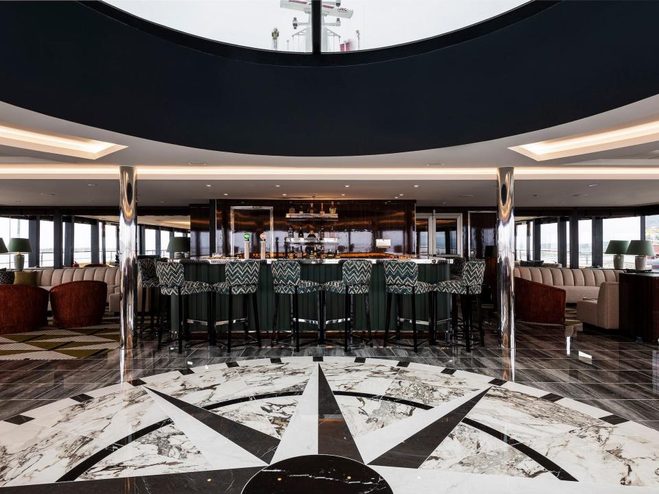 a bar inside the lounge with the glass ceiling