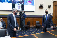 Federal Reserve Chair Jerome Powell, left, and Treasury Secretary Steven Mnuchin arrive for a House Financial Services Committee hearing on Capitol Hill in Washington, Wednesday, Dec. 2, 2020. (Jim Lo Scalzo/Pool via AP)