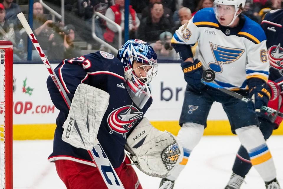 Dec 8, 2023; Columbus, Ohio, USA; Columbus Blue Jackets goaltender Jet Greaves (73) makes a save in front of St. Louis Blues left wing Jake Neighbours (63) during the second period of the NHL game at Nationwide Arena.