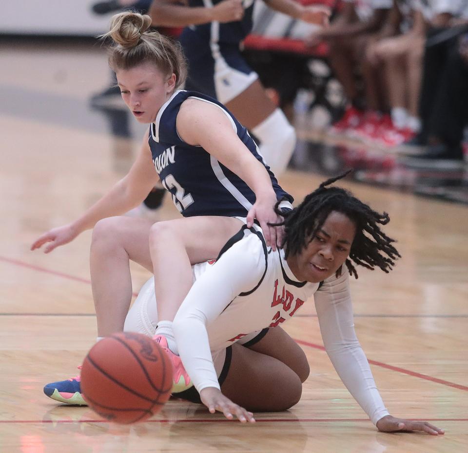 McKinley's Nataijah Davis and Solon's Sophia Lance battle for a loose ball during Saturday's game.