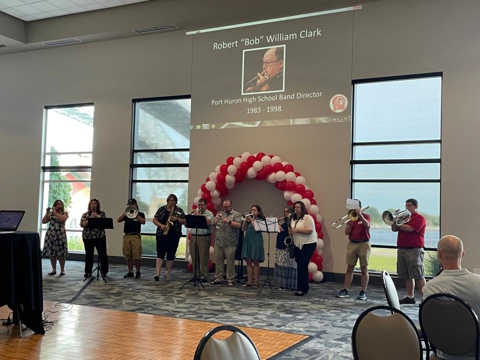 A group of Port Huron High School Band alumni playing the high school fight song at the Robert Clark memorial on July 28, 2023.