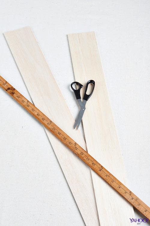 Scissors wood planks and ruler for toy animal house project