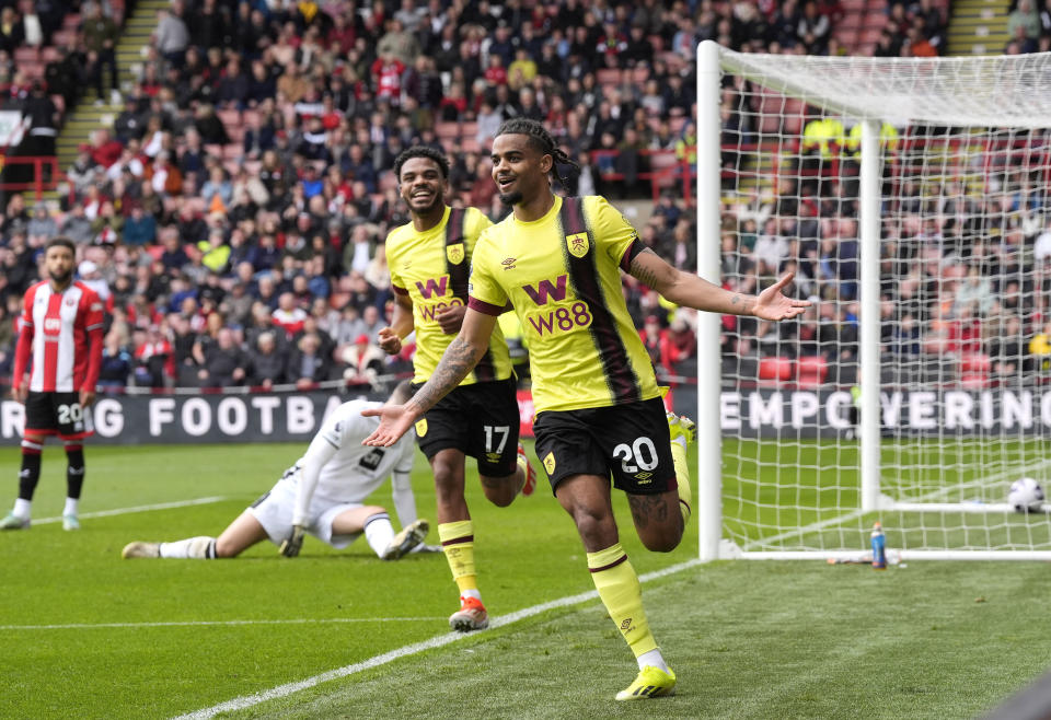 Burnley's Lorenz Assignon celebrates scoring their side's second goal of the game during the English Premier League soccer match between Burnley FC and Sheffield United at Bramall Lane, Sheffield, England, Saturday April 20, 2024. (Danny Lawson/PA via AP)