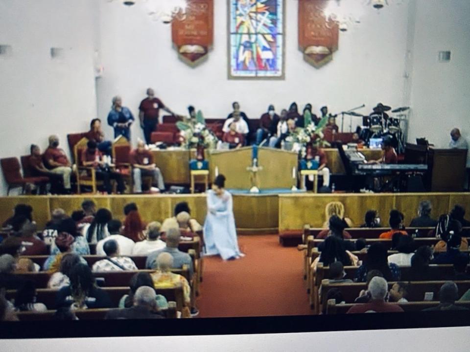 A member of the Greater Bethel AME Church Praise Dance Team performs during the Family and Friends Day service at the church on Sunday.