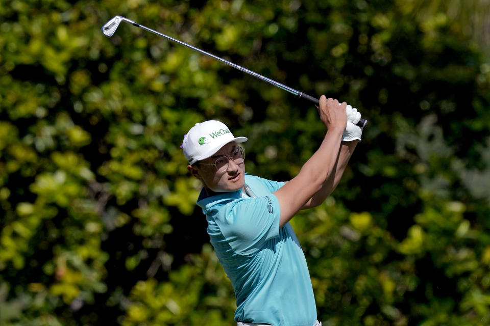 Haotong Li, of China, plays his shot from the 11th tee during the second round of the Sony Open golf tournament, Friday, Jan. 14, 2022, at Waialae Country Club in Honolulu. (AP Photo/Matt York)