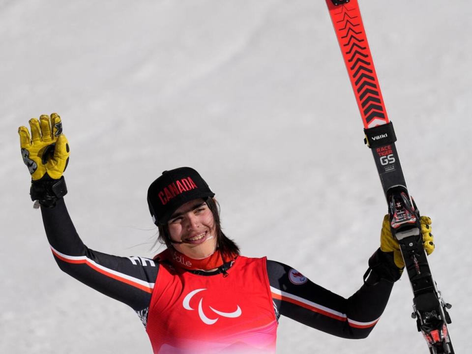 Canada's Alana Ramsay celebrates after racing to bronze in the standing super-combined event at the Beijing Paralympics. Ramsay is one of five Canadian women to win medals thus far at the 2022 Games, and the only one to land on two podiums. (Aly Song/Reuters - image credit)