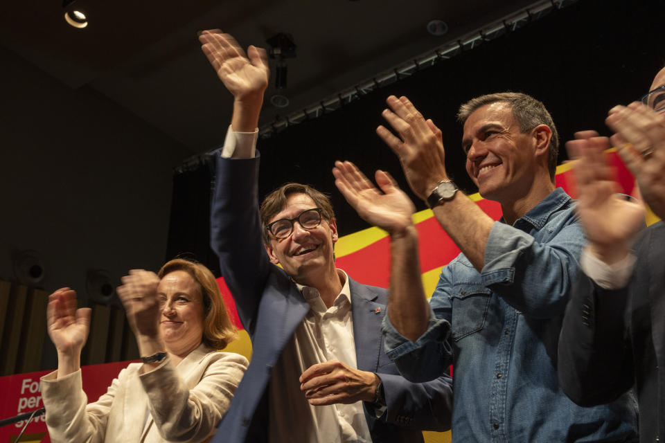 Socialist candidate Salvador Illa waves to the crowd next to Spanish Prime Minister Pedro S·nchez during a campaign rally in Villanova i la Gertru, near Barcelona, Spain, Thursday, May 9, 2024. Some nearly 6 million Catalans are called to cast ballots in regional elections on Sunday that will surely have reverberations in Spain's national politics. (AP Photo/Emilio Morenatti)