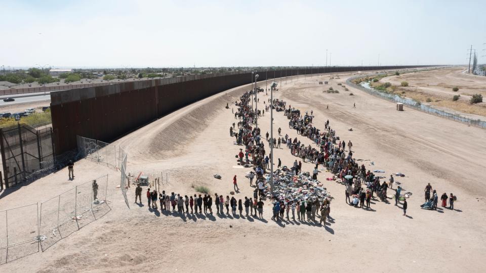 Migrants wait to be processed by Customs and Border Protection at gate 42 on Wednesday, May 10, 2023 in El Paso, Texas. 