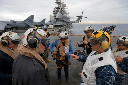 USS Bonhomme Richard amphibious assault ship Executive Officer Rich Lebron (2nd R) speaks to Australian journalists in the Pacific Ocean off the coast of Sydney, Australia, before a ceremony marking the start of Talisman Saber 2017, a biennial joint military exercise between the United States and Australia June 29, 2017. REUTERS/Jason Reed