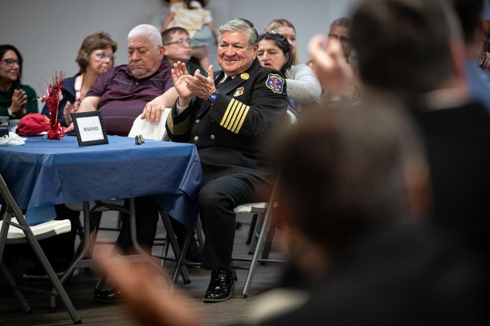 Guests clap with Corpus Christi Fire Chief Robert Rocha for state Sen. Juan "Chuy" Hinojosa during Rocha's retirement ceremony on Friday, Jan. 20, 2023, in Texas.