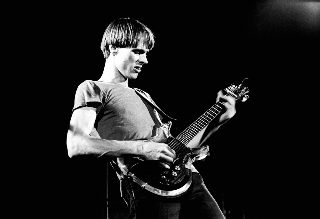 Tom Verlaine of Television performs on stage at Hammersmith Odeon, London, 28 May 1977. He is playing an Ampeg Dan Armstrong guitar. (Gus Stewart / Redferns)