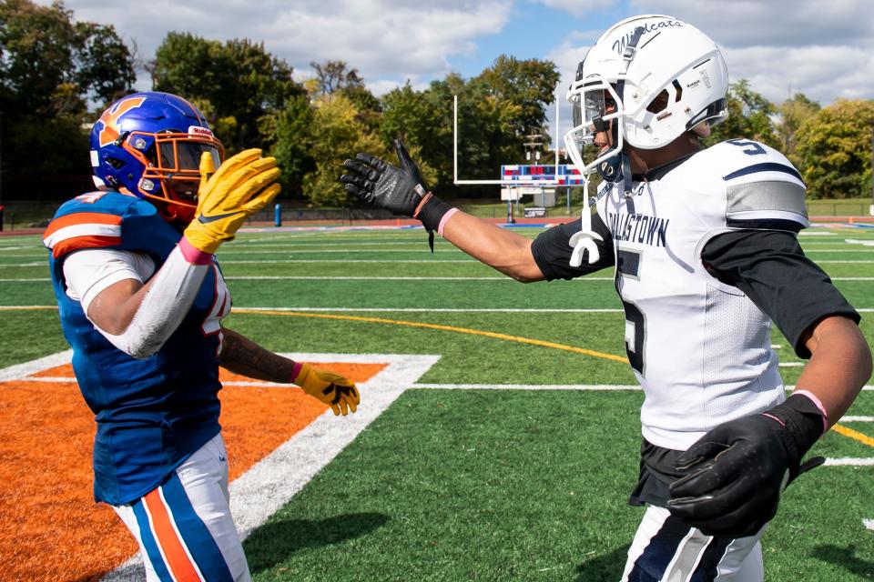 York High's Jahiem White (4) and Dallastown's Kenny Johnson greet each other at midfield after both turning in one of the best games of their high school careers following a YAIAA Division I football game at Small Athletic Field on Saturday, Oct. 8, 2022, in York.