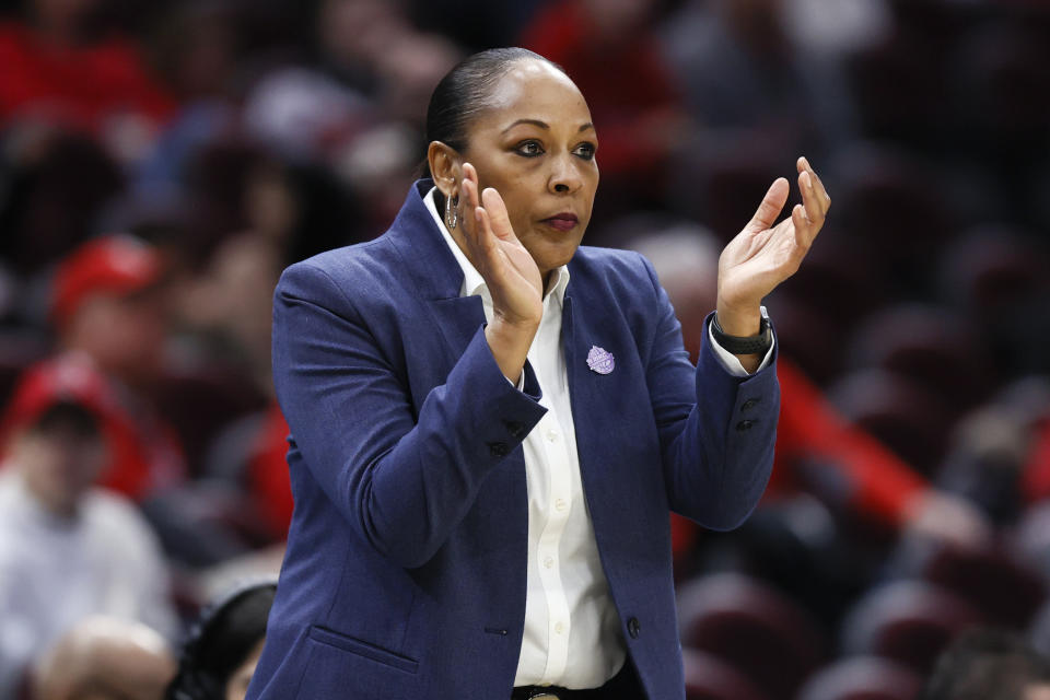 Buffalo head coach Felisha Legette-Jack cheers on her team against Ball State during the first half of an NCAA college basketball game for the championship of the Mid-American Conference women's tournament, Saturday, March 12, 2022, in Cleveland. (AP Photo/Ron Schwane)