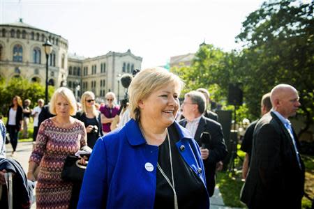 Norway's main opposition leader Erna Solberg (C) of Hoyre smiles as she greets the media in front of the Parliament building in Oslo September 7, 2013, days before the general elections in Norway. REUTERS/Fredrik Varfjell/NTB Scanpix