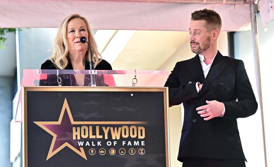 Macaulay Culkin looks on as Catherine O'Hara speaks during his Hollywood Walk of Fame ceremony in Hollywood, California, on Dec. 1, 2023.