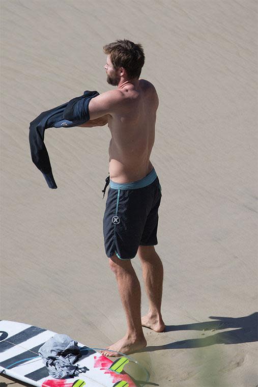 These Hot Photos Of Chris Hemsworth Surfing Will Make Your Friday