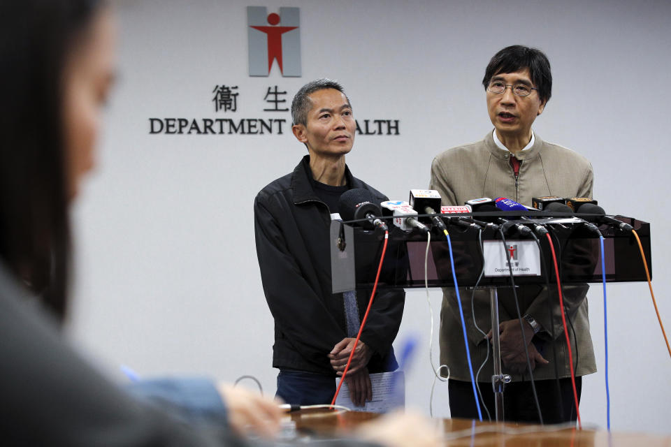 Professor Yuen Kwok-yung, right, speaks next to Wong Ka-hing, the Controller of the Centre for Health Protection of the Department of Health during a press conference at the Health Department in Hong Kong, Saturday, Jan. 11, 2020. Health authorities in the central Chinese city of Wuhan are reporting the first death from a new type of coronavirus. The Wuhan Municipal Health Commission reported Saturday that seven other people are in critical condition. (AP Photo/Andy Wong)