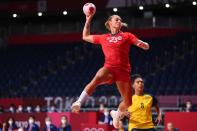 <p>Norway's left wing Camilla Herrem (front) shoots past Sweden's left back Jamina Roberts during the women's bronze medal handball match between Norway and Sweden of the Tokyo 2020 Olympic Games at the Yoyogi National Stadium in Tokyo on August 8, 2021. (Photo by Franck FIFE / AFP)</p> 