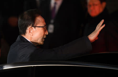 Former South Korean president Lee Myung-bak gets in a car as he is transferred to a detention centre, at his residence in Seoul, South Korea March 23, 2018. Jung Yeon-je/Pool via Reuters