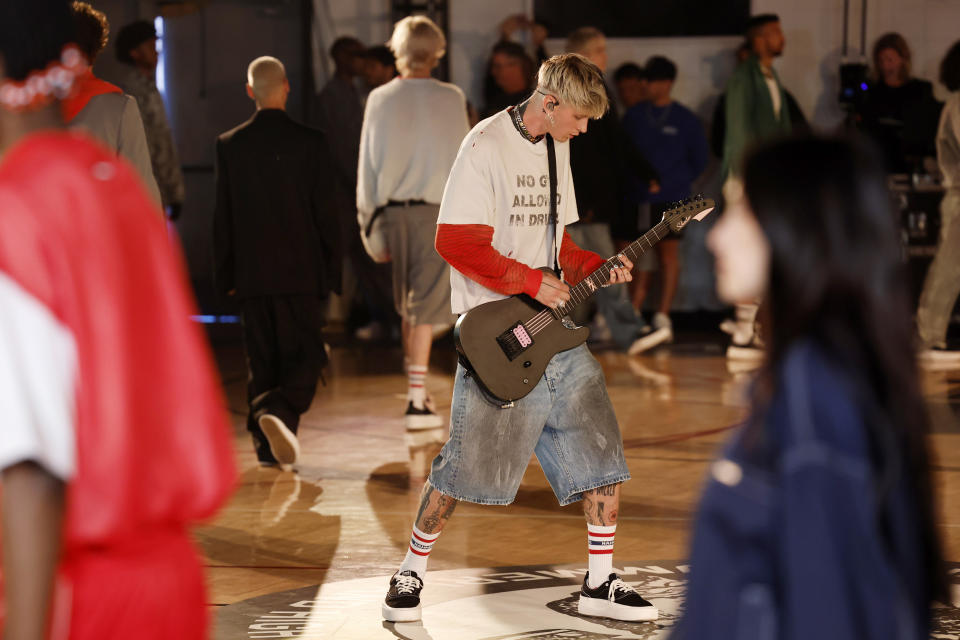 Machine Gun Kelly performs during the Nahmias SS25 Menswear Show at Pan Pacific Park in Los Angeles wearing the Ollie shoe
