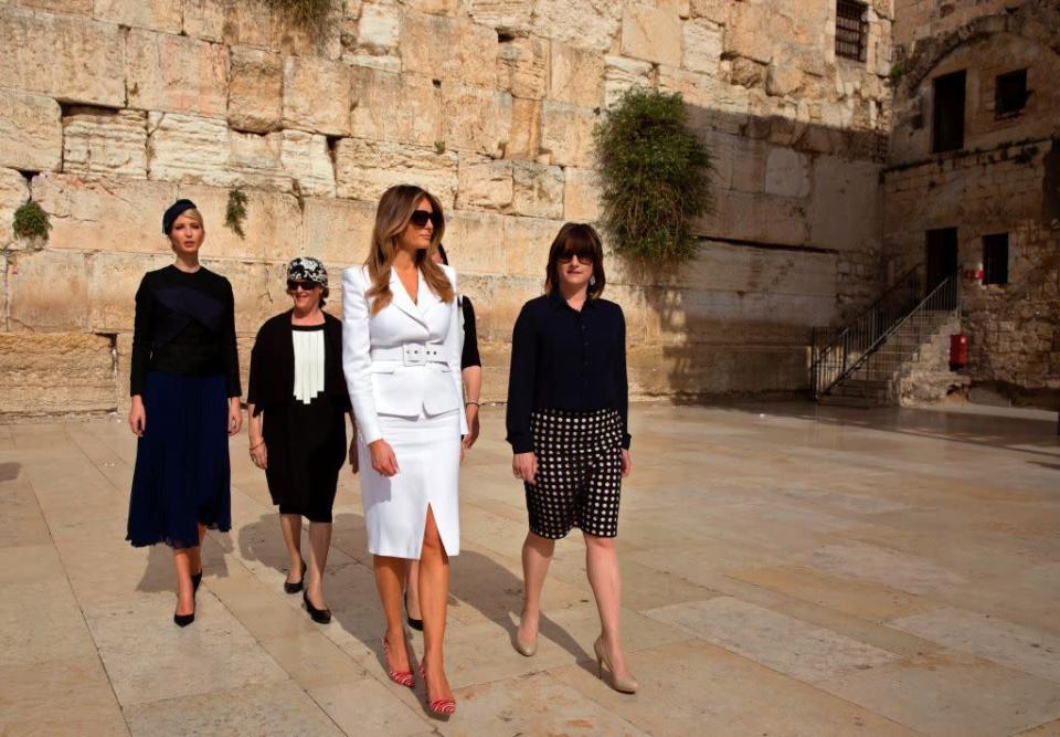 <p>The Trumps visited the Western Wall in Jerusalem, where FLOTUS wore a white suit with a pencil skirt and belted blazer by Michael Kors. </p>