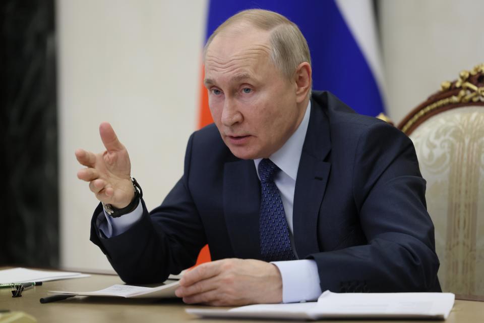 Russian President Vladimir Putin gestures while speaking during the annual meeting of the Presidential Council for Civil Society and Human Rights via videoconference in Moscow, Russia, Wednesday, Dec. 7, 2022. (Mikhail Metzel, Sputnik, Kremlin Pool Photo via AP)