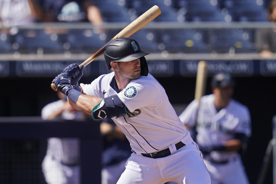 Seattle Mariners' Mitch Haniger bats during a spring training baseball game against the Oakland Athletics, Saturday, March 6, 2021, in Peoria, Ariz. (AP Photo/Sue Ogrocki)