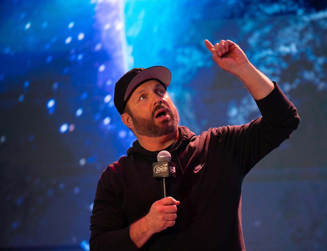 Garth Brooks entertains questions on the stage his new honky-tonk, Friends in Low Places, in Nashville, Tenn., Monday, Nov. 20, 2023.