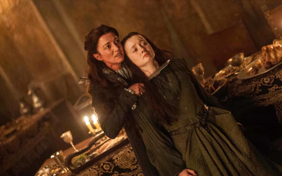 Michelle Fairley as Catelyn Stark, with Kelly Ford, during the Red Wedding scene in Game of Thrones - Credit: HBO