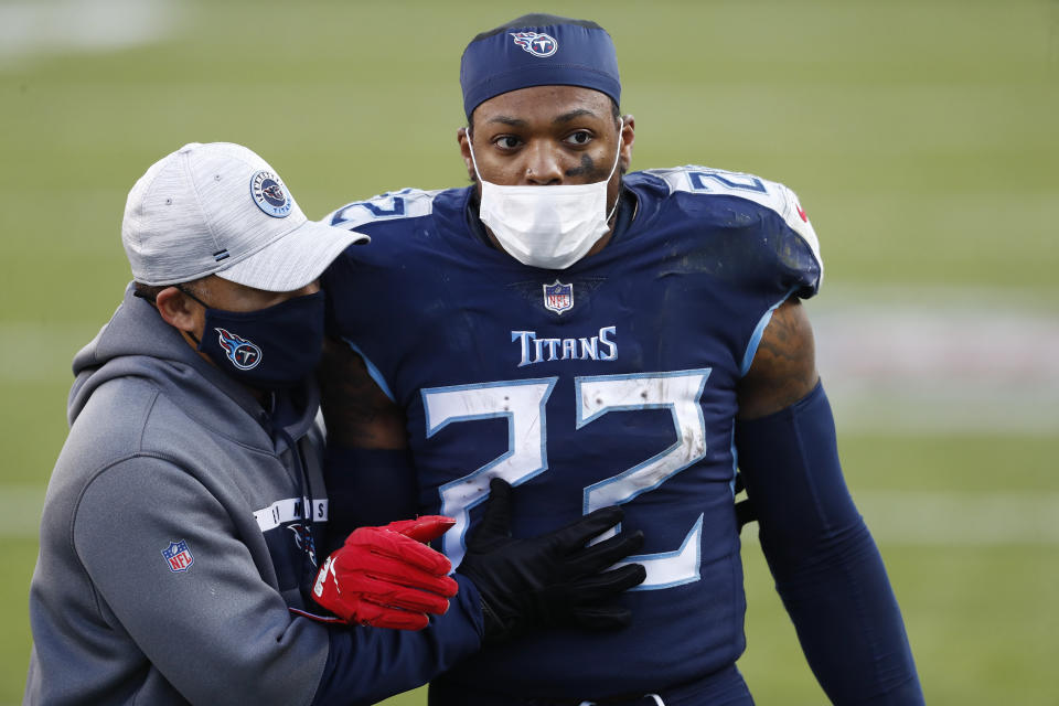 Tennessee Titans running back Derrick Henry (22) leaves the field after the Titans lost to the Baltimore Ravens in an NFL wild-card playoff football game Sunday, Jan. 10, 2021, in Nashville, Tenn. The Ravens won 20-13. (AP Photo/Wade Payne)