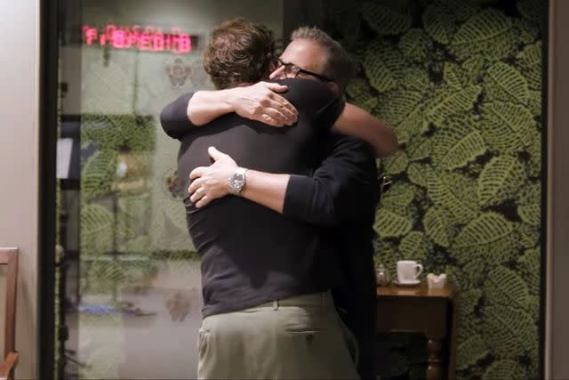 <p>Paramount Pictures/YouTube</p> Steve Carell and John Krasinski share a hug while filming 'IF'