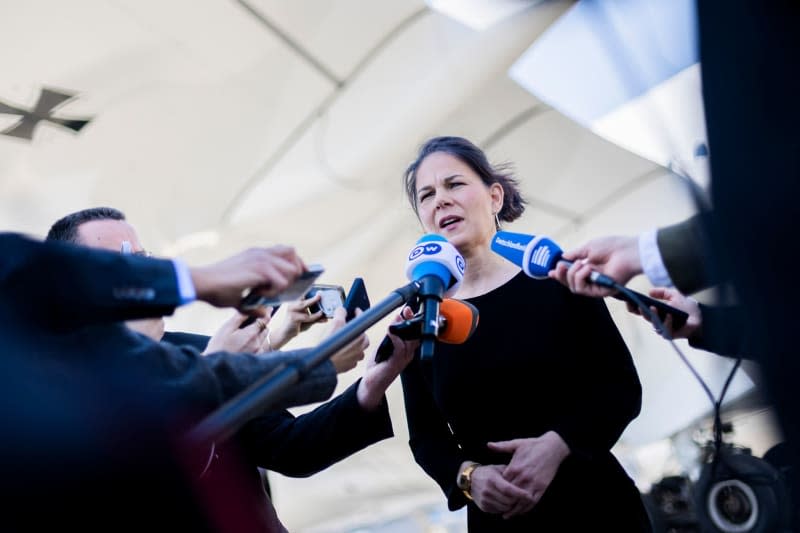 German Foreign Minister Annalena Baerbock gives a press statement in front of the Air Force Airbus A350 at Cairo International Airport before flying to Israel. Christoph Soeder/dpa