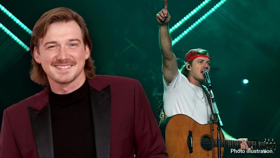 Morgan Wallen wears red tuxedo and performs on stage at a country concert