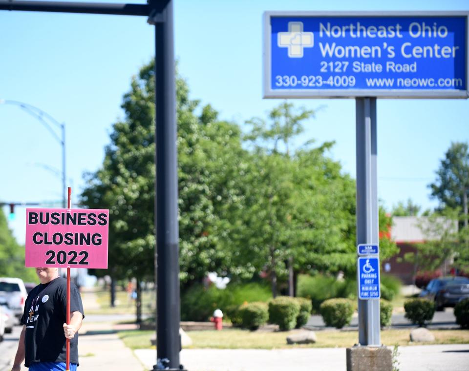 An anti-abortion protester outside Northeast Ohio Women's Center in Cuyahoga Falls on Friday shortly after the Dobbs v. Jackson Women's Health Organization decision was released.