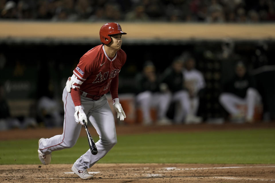 Los Angeles Angels' Shohei Ohtani watches his double against the Oakland Athletics during the sixth inning of a baseball game Friday, Sept. 1, 2023, in Oakland, Calif. (AP Photo/Godofredo A. Vásquez)