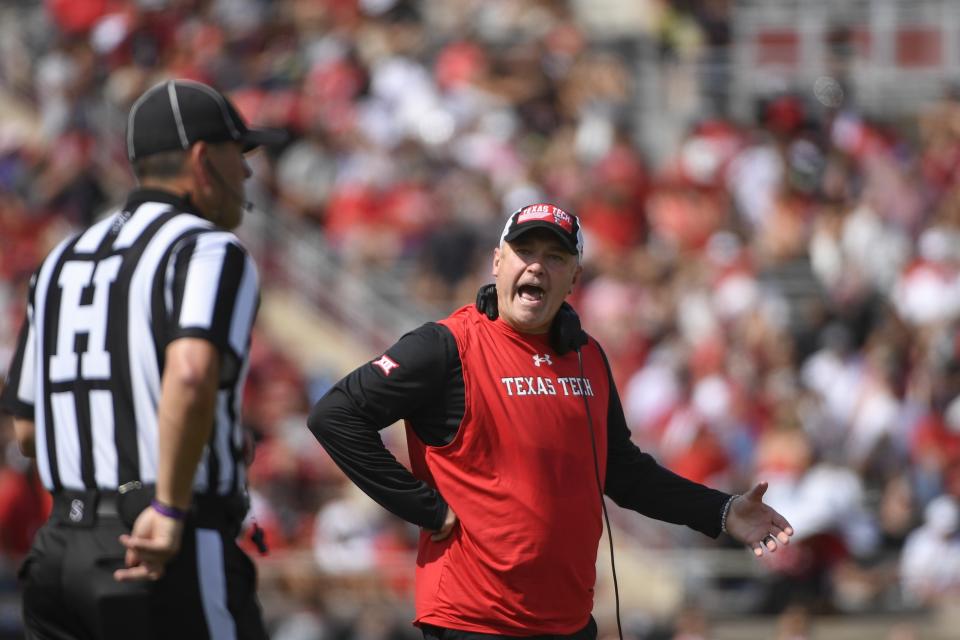 CORRECTS CITY TO IN LUBBOCK, TEXAS - Texas Tech head coach Joey McGuire argues with the head linesman against Houston during the first half of an NCAA college football game Saturday, Sept. 10, 2022, in Lubbock, Texas. (AP Photo/Justin Rex)