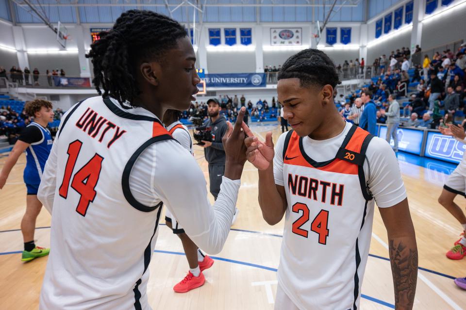 North's Teshaun Steele and Ameren Minor celebrate after the Polar Bears defeated Leominster in the Central Mass. Class A Championship on Thursday at Worcester State University.