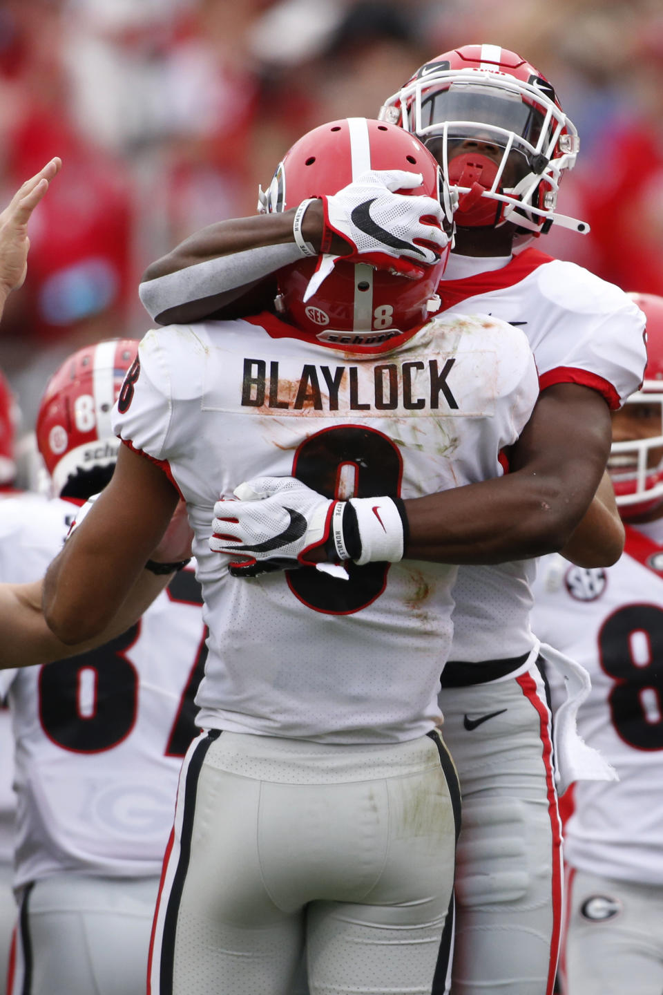 Georgia wide receiver Dominick Blaylock (8) celebrates with wide receiver George Pickens (1) after scoring a touchdown in the first half of a NCAA college football game against Florida, Saturday, Nov. 2, 2019, in Jacksonville, Fla. (Joshua L. Jones/Athens Banner-Herald via AP)