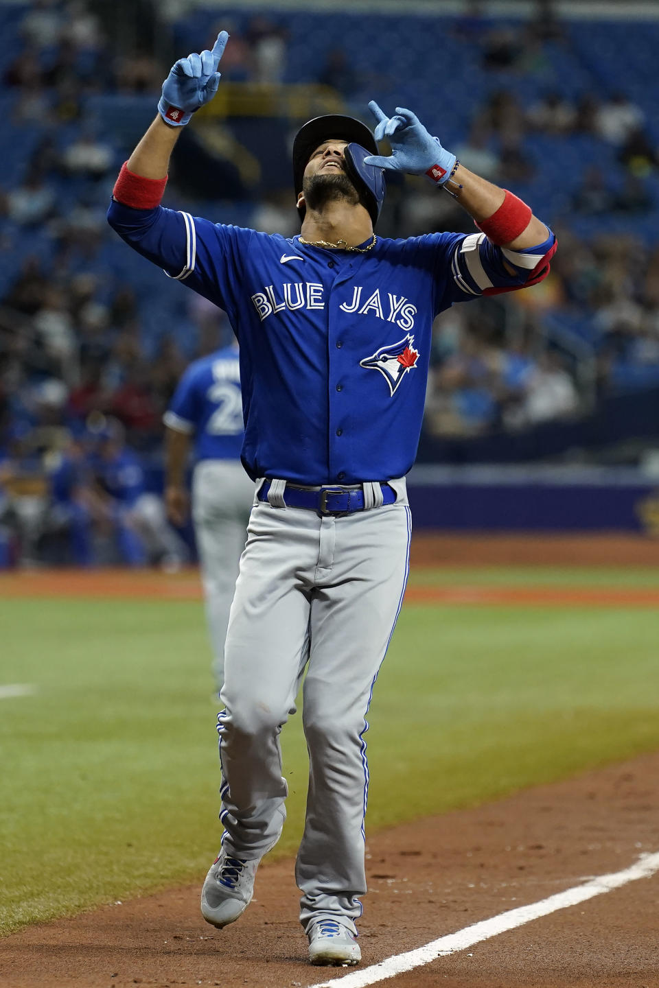 Toronto Blue Jays' Lourdes Gurriel Jr. celebrates his solo home run off Tampa Bay Rays' Drew Rasmussen during the fifth inning of a baseball game Tuesday, Sept. 21, 2021, in St. Petersburg, Fla. (AP Photo/Chris O'Meara)